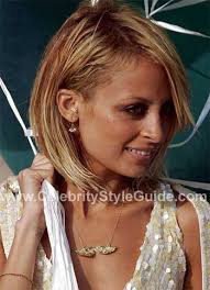 Nicole Richie wearing CC Skye Angel Wing necklace