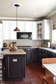 Black Kitchen Cabinets Blue Kitchen Cabinets Brown Kitchen Cabinets Kitchen Cabinets With Black Appliances Black Appliances Kitchen Kitchen Cabinet Design