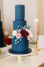 The colour scheme for their wedding was of ivory, cornflower blue and navy blue. Cake Designs