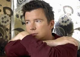 Rick Astley Never Gonna Give You Up Video Download The Trench Coat Wearing 80s Pop Sensation Rick Astley Talks Fame Flying And How Annoying It Must Be To Be Rickroll Rick Astley Rick Astley Never Gonna Rick