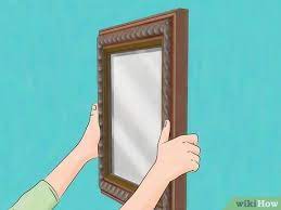 I die überschubrahmen von finstral werden einfach über die vorhandenen rahmen gesetzt. Einen Spiegel Rahmen Wikihow