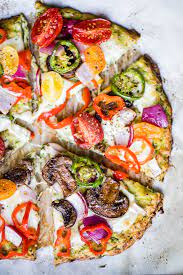 Delicious Zucchini Pizza Crust Recipe Low Carb Ambitious Kitchen Recipe Zucchini Pizzas Zucchini Pizza Crust Healthy Veggies