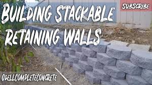 Retaining walls made of standard block can stand alone, but they offer little aesthetic value. How To Build A Stackable Retaining Wall Youtube