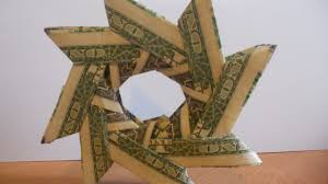 Here's a modular money origami star made from new canadian plastic $20 bills by reader marlene. How To Make A Money Origami Wreath