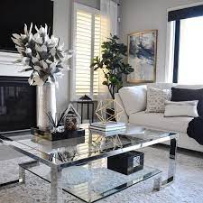 beautiful living room i love the white and black theme it has coffee table flowers and v black living room table decor living room modern white living room