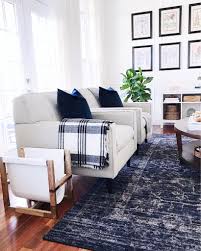 Blue And White In The Living Room With A Touch Of Plaid Traditional Design Living Room Navy Rug Living Room Farm House Living Room