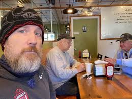 Wayside bacon cheeseburger with overflowing egg