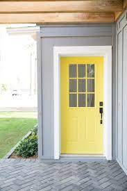 Yellow Front Door On Gray House