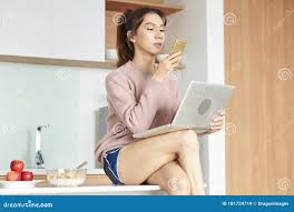 Ladyboy checking phone stock image. Image of adults - 181724719