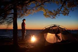 Camping with your family is a great way to spend quality time together without any of the distractions of your busy life at home. Woman Having A Rest At Night Camping Near Tourist Tent Campfire On Sea Shore Under Starry Sky Stock Photo Image Of Lifestyle Outdoor 139565490