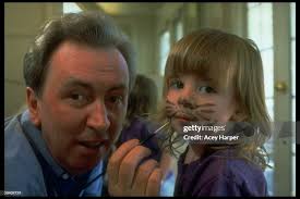Pop singer Al Stewart painting cat whiskers