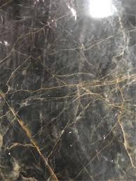 If you are considering installing marble floors, here is what you need to know beforehand. Black Marble Slab With Yellow Veins Natural Marble Tile Supplier Hangmao