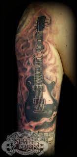 A tattoo design depicting the guitar and that too tribal style is something that can be really appealing. State Of Art Tattoo On Twitter Music Tattoo Designs Tattoos Music Tattoos