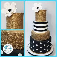 The confectioner decorates a black cake, gold food paint. Black White And Gold 40th Birthday Cake Blue Sheep Bake Shop