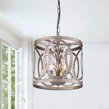 This hanging ceiling fixture has a glass globe decorated with flowers and butterflies and a lovely copper hue to clear glass. Aurelia 3 Light Brushed Champagne Metal Cage Drum Chandelier