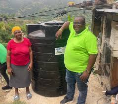 title We continue our partnership with the Ministry of Economic Growth and  Job Creation (MEGJC) under their islandwide Water Tank Distribution  program. Councillor Caretaker Lloyd Benjamin represented me at Top Bank,  Mavis