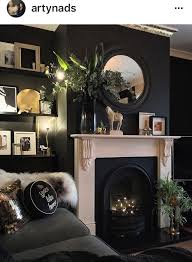 The print of this foyer's floral wallpaper is traditional enough, but in black and white it looks so fresh and exciting. Black Living Room Blacklivingroom Dark Living Rooms Black Living Room Living Room Designs