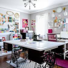 Crafty themed sewing room the crafty pictures appear to jump out off the wall in this simple, ethereal sewing room. Craft Room Ideas Beautiful Sewing Craft Spaces To Inspire You