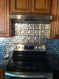Pin By Lisa Bergquist On Dream Kitchen Tin Backsplash Backsplash Metallic Backsplash
