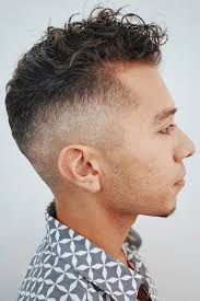 The curls are held up high while the sides are shaved. Top Curly Hairstyles For Men To Suit Any Occasion Menshaircuts Com