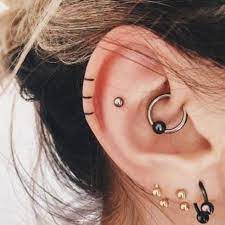 40 Beautifully Delicate And Small Helix Tattoos To Inspire Your Next Body Art Helix Tattoo Ear Tattoos Ear Piercings
