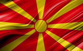 Displays a stylized yellow sun on a red background, with eight rays extending from the center to each edge. Download Wallpapers 4k Macedonian Flag European Countries 3d Waves Flag Of North Macedonia National Symbols North Macedonia 3d Flag Art Europe North Macedonia For Desktop Free Pictures For Desktop Free