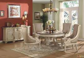 This dining set is crafted from rubberwood veneer and mango wood with a charming driftwood and white finish. Halyn Antique White Round Formal Dining Room Set