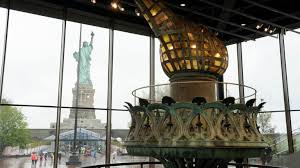 The statue was originally made of shining copper, but the weather turned it green over the years. Statue Of Liberty Museum Now 26 000 Square Feet Highlights Original Torch Historical Significance Amnewyork