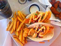 The fish—we use cod, but any flaky variety works—marinates in a mixture of lime juice, chili powder, and cumin that will become your standard. My Fish Tacos Picture Of Oceanic Restaurant Wrightsville Beach Tripadvisor