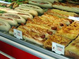 These French Hotdogs With Melted Gruyere On Them Were In The Cafe Windows Everywhere Omg So Tasty Paris Street Food Hot Dog Recipes Unique Hot Dogs