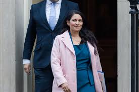 The committee advising the government on vaccines has also said it will consider factors like exposure risk and occupation in the rollout's next phase. Who Are Priti Patel S Parents Home Secretary Admits New Immigration Laws Would Affect Own Family Hitc