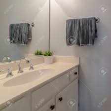 square frame neat small white bathroom