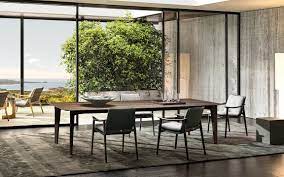 Armchairs and a table on an open terrace. Penthouse Dining Tables En