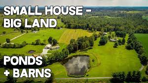 Video One Of A Kind Showplace On 26 Acres 3 Stocked Ponds Barns Creek Clubhouse In 2020 Small House Land For Sale Farm Pond