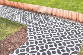 Here, the angles of the pavers are replicated in the angles of the corner bed. Stylish But Simple Small Garden Ideas Loveproperty Com
