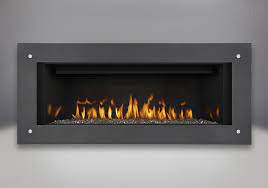 Shown with surround with safety barrier (not included). Napoleon Linear 45 Port Perry Gas Fireplaces