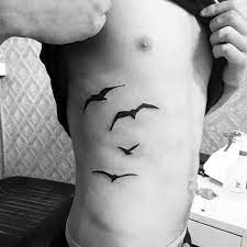 100 Silhouette Tattoo Designs For Men Shadowy Illustration Silhouette Tattoos Rib Tattoos For Men Tattoo Designs Men