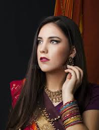 Beauty Brunette Indian Woman Portrait. Hindu Model Girl with Brown Eyes.  Indian Girl in Sari Stock Photo