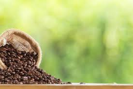 Download Coffee Bean In Sack On Wooden Tabletop Against Grunge Green Blur Background For Free Coffee Graphics Coffee Beans Best Photoshop Actions