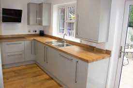 Creamy walls with white shelving will help to lighten up a small kitchen, and placing white wall tiles above the worktops will add a hint of vintage. Ljm Building Solutions What We Do Installations