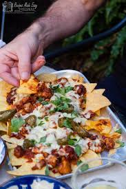 Easy bbq chicken nachos loaded with juicy chicken, lots of hot, stretchy cheese, fresh tomatoes and red onions! Easy Chicken Nachos Recipes Made Easy