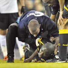 Medics move muamba to an ambulance after. Muamba Still In Critical Condition