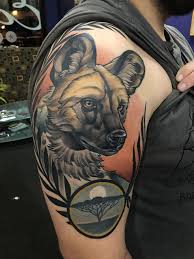Best Black And Grey Tattoo Artists In Michigan African Wild Dog By James Hurley At Eclectic Tattoo Shop In East Lansing Michigan African Wild Dog African Tattoo Dog Tattoos