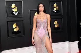 Versace has no shortage of celebrity devotees but every so often, one will snag the ultimate donatella seal of approval: Dua Lipa S 2021 Grammys Look Is A Versace Butterfly Dress Just Like Christina Aguilera In 2000
