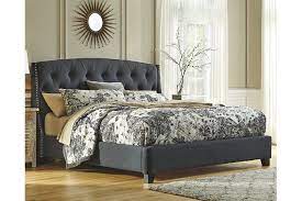 Finely Tailored For Fashionable Tastes Kasidon Queen Bed Has A Dramtic Tufted Headboard Finessed Wi King Upholstered Bed Upholstered Beds Grey Upholstered Bed