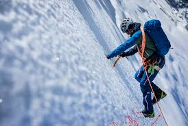 glacier with crampons and an ice axe ...