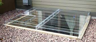 A fresh plastic cover off the store shelf has yet to be exposed to the elements. Acrylic Egress Window Well Covers Custom Plastics Fargo Nd