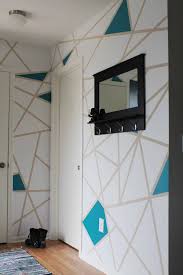 Wooden planks in shades of mint green and different pinks were used here, and an accent was also embedded into the actual accent wall with the use of metallic gold planks among the pastel colors. Diy Painter S Tape Accent Wall