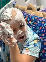 Child plays with shaving cream