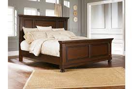 Porter queen storage bed the warm rustic beauty of the porter bedroom collection by ashley furniture uses a deep, rich finish and ornate details to create an inviting collection that fits comfortably into any bedroom décor. Porter Queen Panel Bed Ashley Furniture Homestore